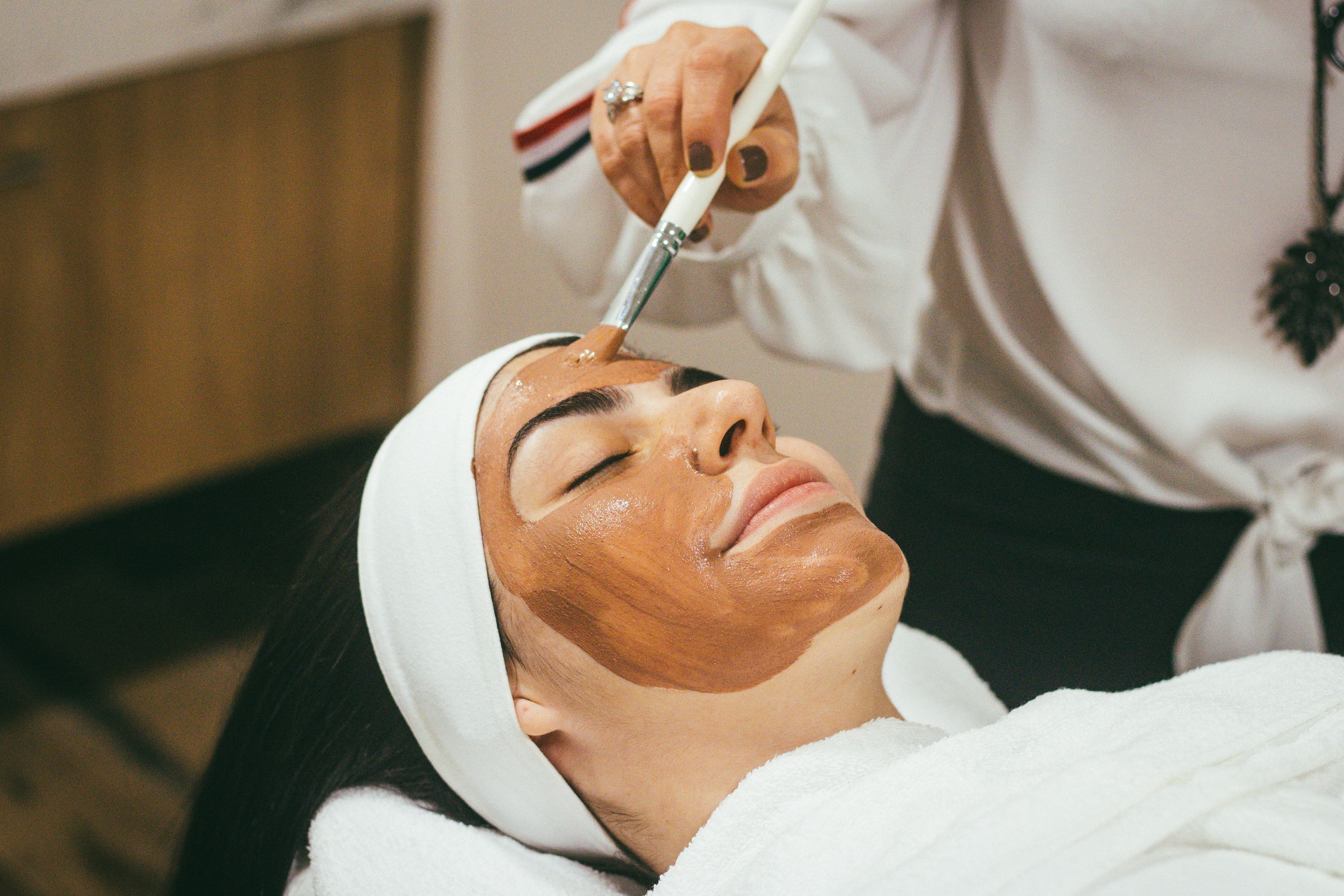 Woman applying skincare product